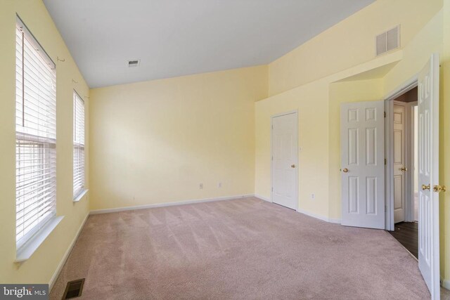 unfurnished bedroom with carpet and baseboards