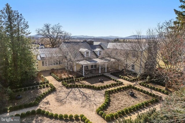  - aerial view of property and surrounding area featuring a mountain backdrop