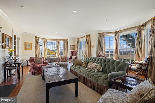  - living room with ornamental molding, wood finished floors, wainscoting, and recessed lighting