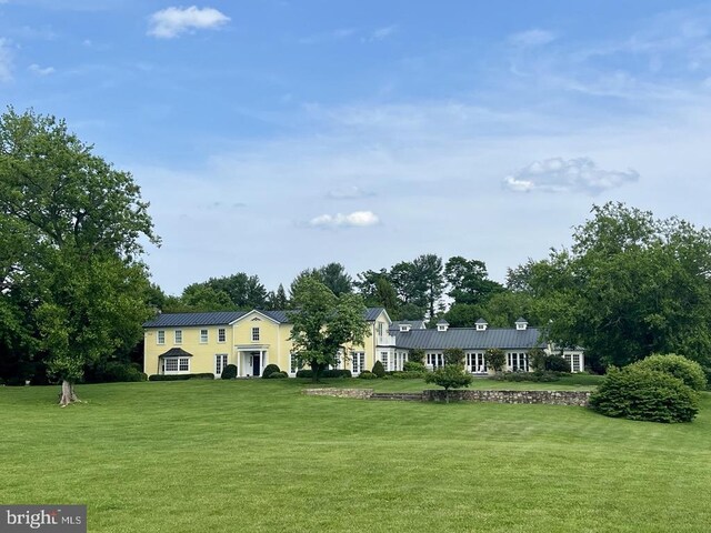  - view of front of property with a front yard