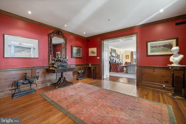 - office space with ornamental molding, hardwood / wood-style flooring, wainscoting, and recessed lighting