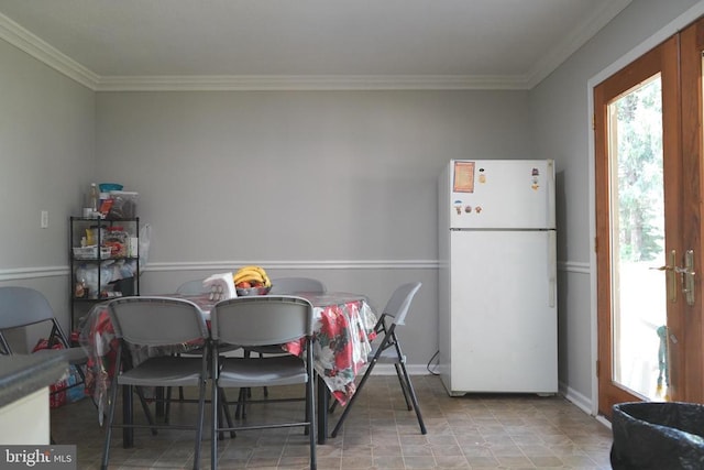 214 Culpeper St W, Culpeper, VA 22701 - dining space featuring crown molding and baseboards