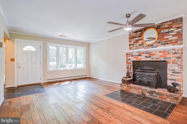  - unfurnished living room featuring a baseboard heating unit, a ceiling fan, crown molding, and hardwood / wood-style flooring