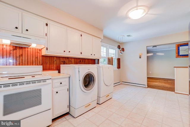  - washroom with a baseboard radiator, independent washer and dryer, light flooring, and wooden walls