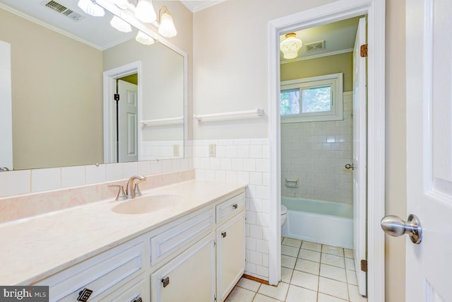  - bathroom with crown molding, vanity, tile patterned flooring, tile walls, and  shower combination