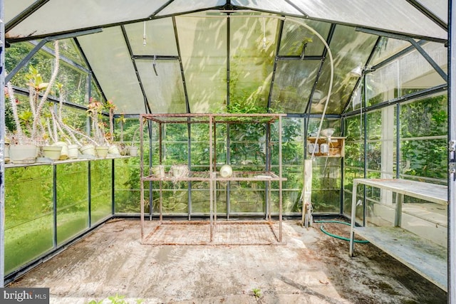 - unfurnished sunroom featuring lofted ceiling
