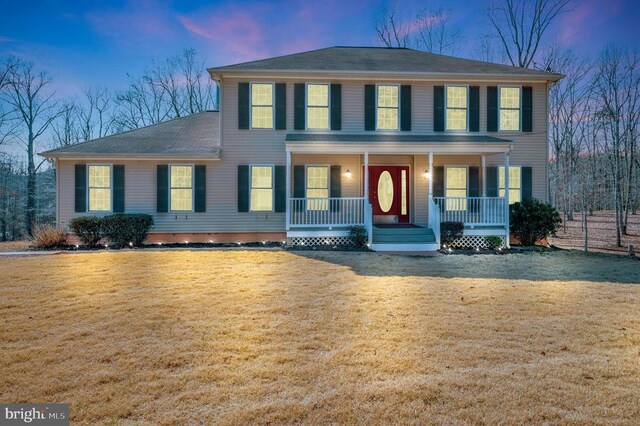 8128 Shirley Rd, Spotsylvania, VA 22551 - colonial house with a porch, a yard, and roof with shingles