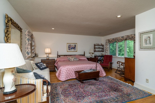16540 Stoney Lea Ln, Elkton, VA 22827 - bedroom featuring wood finished floors, a textured ceiling, and recessed lighting