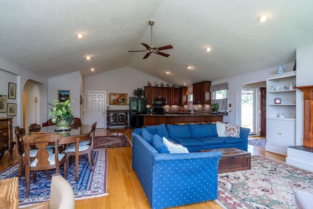 16540 Stoney Lea Ln, Elkton, VA 22827 - living room with arched walkways, ceiling fan, vaulted ceiling, light wood-type flooring, and wine cooler