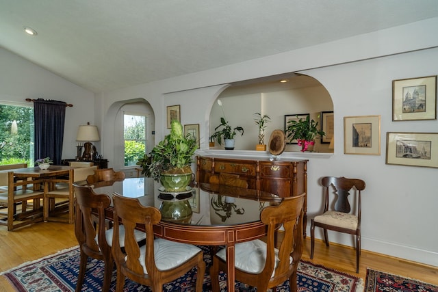 16540 Stoney Lea Ln, Elkton, VA 22827 - dining room with arched walkways, wood finished floors, vaulted ceiling, and recessed lighting