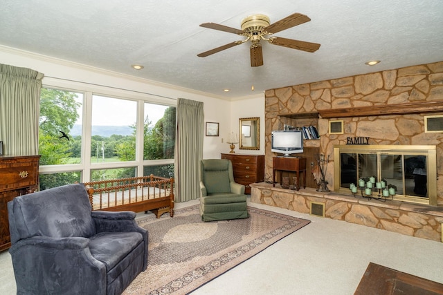 16540 Stoney Lea Ln, Elkton, VA 22827 - carpeted living room featuring ceiling fan, a fireplace, a textured ceiling, ornamental molding, and recessed lighting