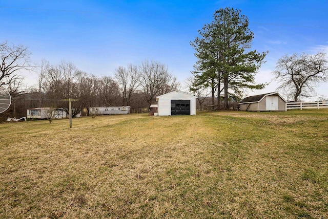 14335 S E Side Hwy, Grottoes, VA 24441 - view of yard featuring an outbuilding, fence, and a garage