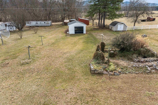 14335 S E Side Hwy, Grottoes, VA 24441 - view of yard featuring an outdoor structure, fence, and a storage unit