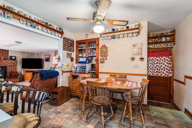 14335 S E Side Hwy, Grottoes, VA 24441 - dining room with a ceiling fan, wallpapered walls, a toaster, stone finish floor, and wainscoting