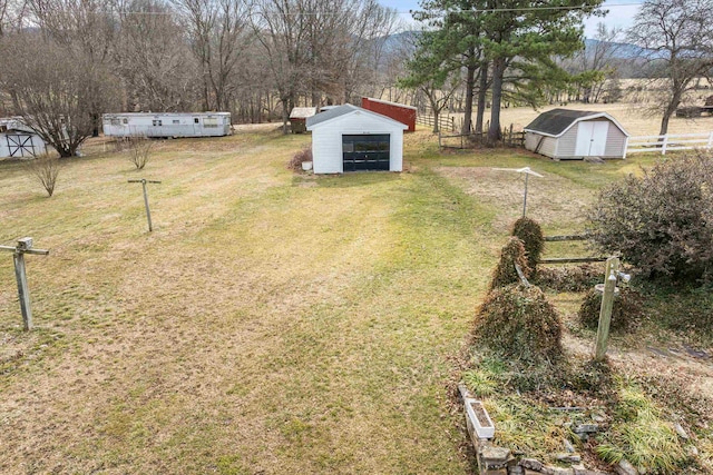 14335 S E Side Hwy, Grottoes, VA 24441 - view of yard with a shed, a garage, an outdoor structure, and fence