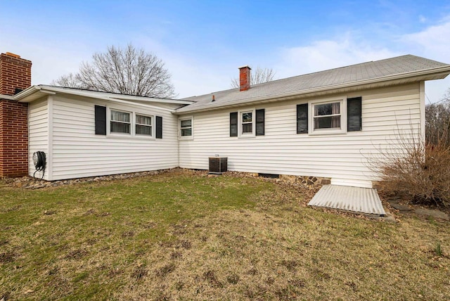 14335 S E Side Hwy, Grottoes, VA 24441 - back of property featuring a chimney, cooling unit, and a lawn