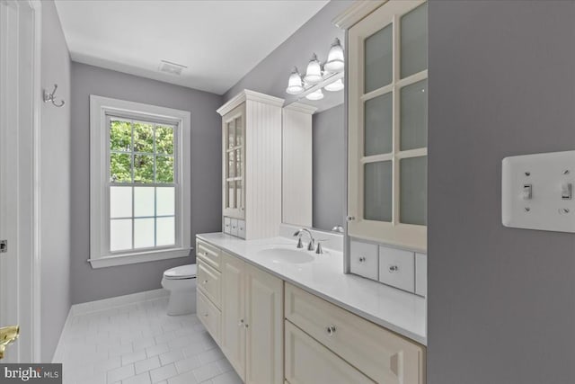 8606 Laroque Run Dr, Fredericksburg, VA 22407 - bathroom with toilet, visible vents, baseboards, tile patterned flooring, and vanity