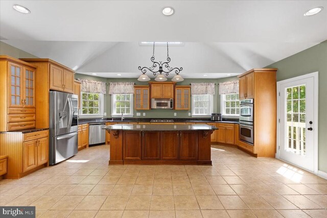 8606 Laroque Run Dr, Fredericksburg, VA 22407 - kitchen featuring a sink, recessed lighting, vaulted ceiling, a center island, and appliances with stainless steel finishes