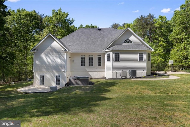 8606 Laroque Run Dr, Fredericksburg, VA 22407 - back of house with a patio, cooling unit, a lawn, a shingled roof, and a hot tub