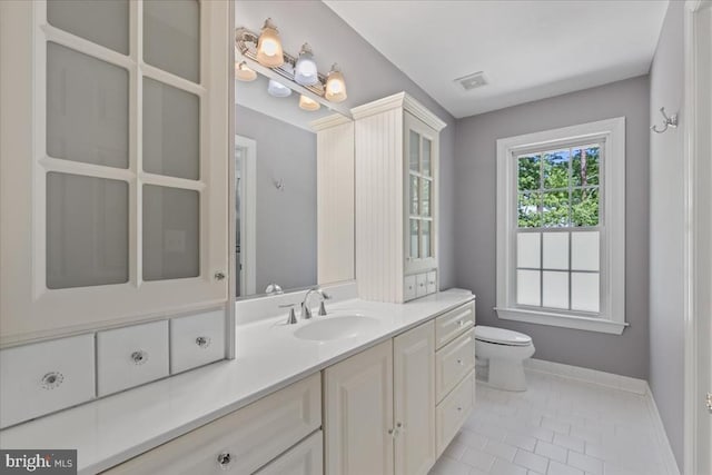 8606 Laroque Run Dr, Fredericksburg, VA 22407 - bathroom with toilet, baseboards, visible vents, tile patterned flooring, and vanity