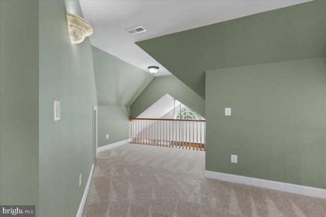 8606 Laroque Run Dr, Fredericksburg, VA 22407 - additional living space with carpet, visible vents, baseboards, and lofted ceiling