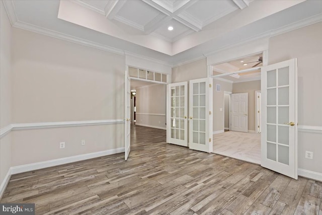 8606 Laroque Run Dr, Fredericksburg, VA 22407 - empty room featuring coffered ceiling, wood finished floors, french doors, and crown molding