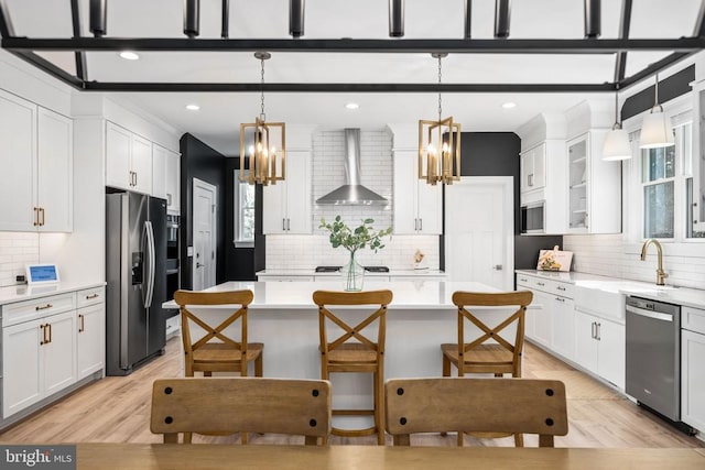 11302 Radcliff Ter, Spotsylvania, VA 22551 - kitchen with wall chimney range hood, stainless steel appliances, a chandelier, backsplash, and recessed lighting