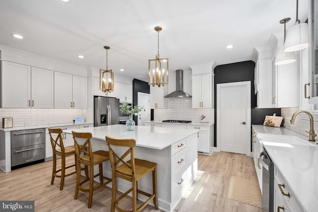 11302 Radcliff Ter, Spotsylvania, VA 22551 - kitchen with wall chimney exhaust hood, stainless steel fridge, tasteful backsplash, a chandelier, and gas stovetop