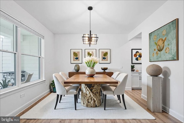 11302 Radcliff Ter, Spotsylvania, VA 22551 - dining area with light wood finished floors and a chandelier