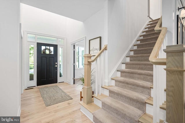 11302 Radcliff Ter, Spotsylvania, VA 22551 - foyer entrance featuring stairway, a towering ceiling, and wood finished floors