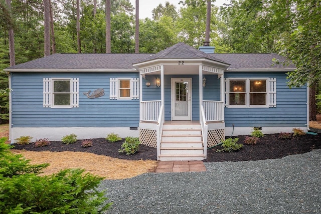 22 Loblolly Rd, Palmyra, VA 22963 - view of front facade featuring a porch, crawl space, a shingled roof, and view of wooded area