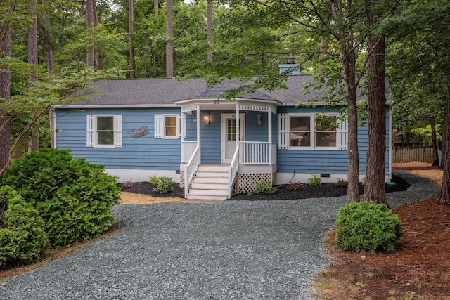 22 Loblolly Rd, Palmyra, VA 22963 - bungalow-style home with crawl space, covered porch, a shingled roof, a chimney, and driveway