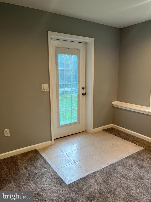 10214 Unique Trl, Rixeyville, VA 22737 - doorway with carpet floors and baseboards