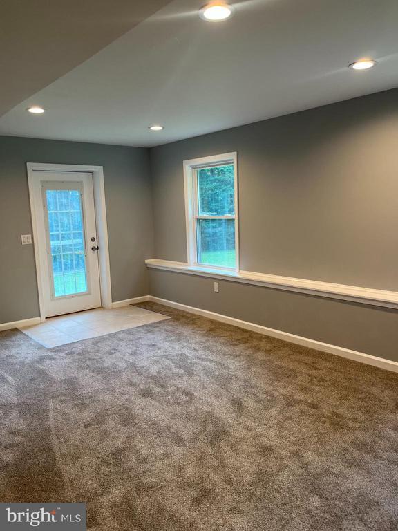 10214 Unique Trl, Rixeyville, VA 22737 - carpeted empty room with baseboards and recessed lighting