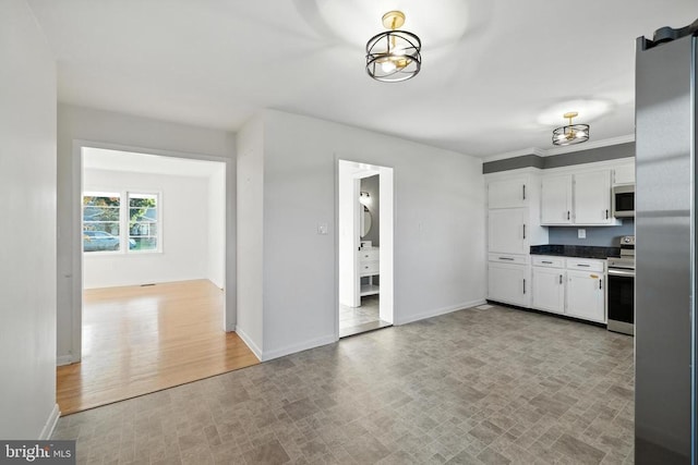 6 Charles St, Luray, VA 22835 - kitchen with stainless steel appliances, white cabinets, and dark countertops