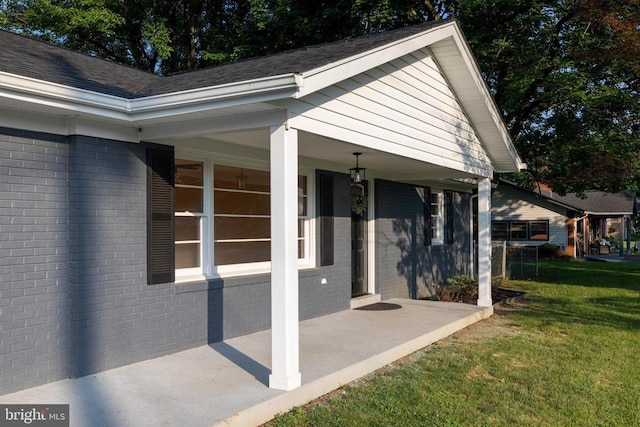 6 Charles St, Luray, VA 22835 - view of property exterior with brick siding, a yard, and a porch