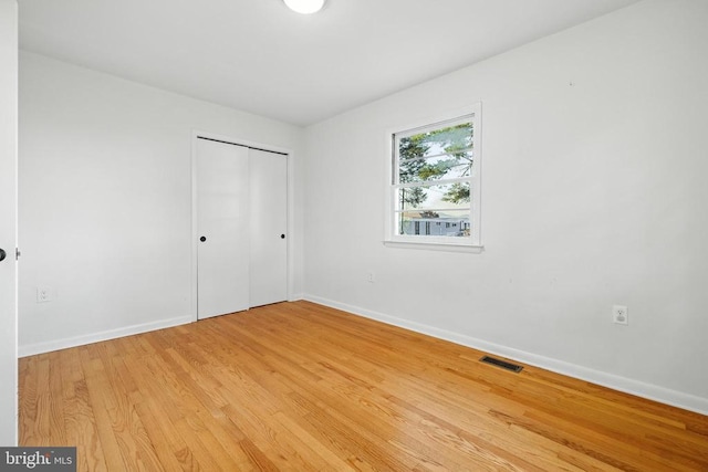 6 Charles St, Luray, VA 22835 - unfurnished bedroom featuring light wood finished floors and a closet