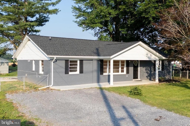 6 Charles St, Luray, VA 22835 - ranch-style house with brick siding, a shingled roof, and a porch