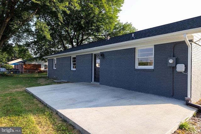 6 Charles St, Luray, VA 22835 - view of home's exterior featuring a patio and brick siding