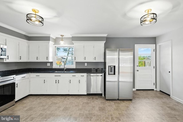 6 Charles St, Luray, VA 22835 - kitchen featuring appliances with stainless steel finishes, healthy amount of natural light, white cabinetry, dark countertops, and ornamental molding