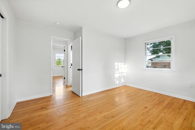 6 Charles St, Luray, VA 22835 - empty room with light wood finished floors and a smoke detector
