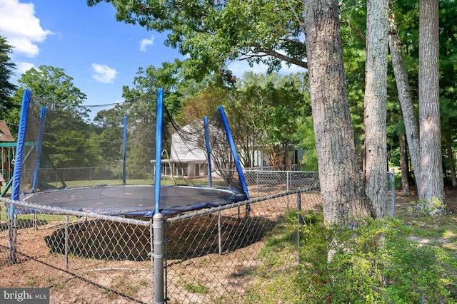  - view of playground featuring a trampoline