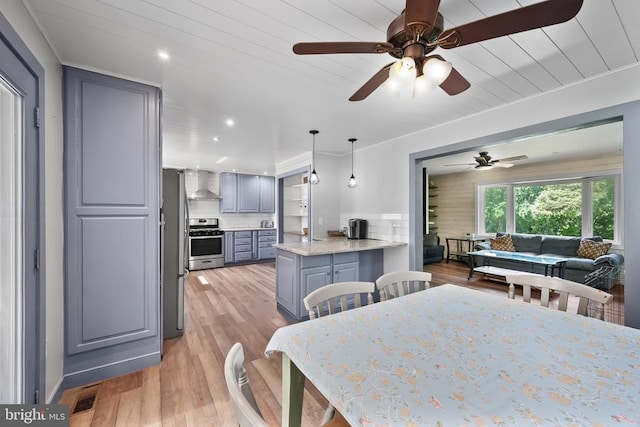  - dining area featuring light wood-type flooring, ceiling fan, and recessed lighting