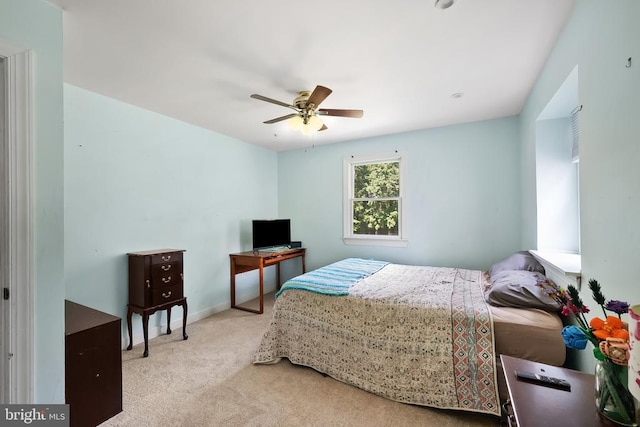  - carpeted bedroom featuring ceiling fan