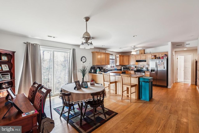 7599 Secretarys Sand Rd, Schuyler, VA 22969 - dining area with a ceiling fan and light wood-style floors