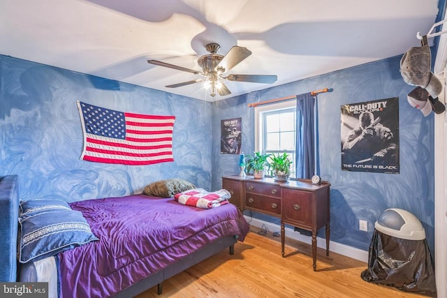 7599 Secretarys Sand Rd, Schuyler, VA 22969 - bedroom with wood finished floors, wallpapered walls, and ceiling fan