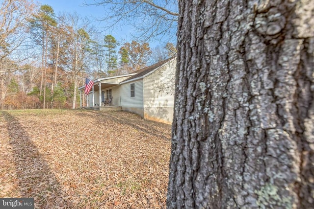 7599 Secretarys Sand Rd, Schuyler, VA 22969 - view of side of property with a porch and an attached carport