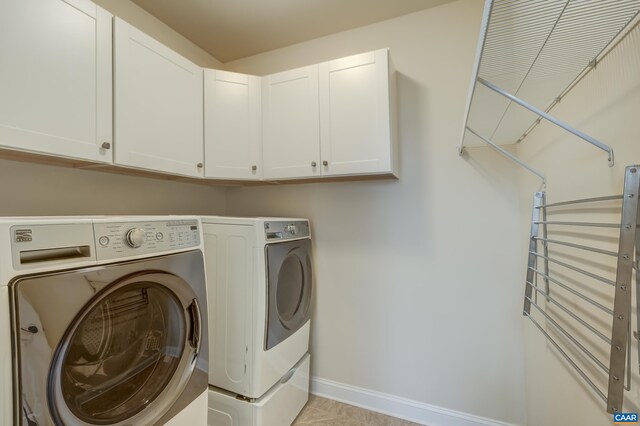 804 Golf View Dr, Crozet, VA 22932 - clothes washing area with washing machine and dryer, cabinet space, and baseboards