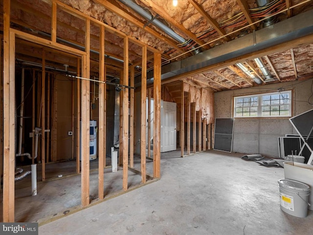 misc room with unfinished concrete flooring