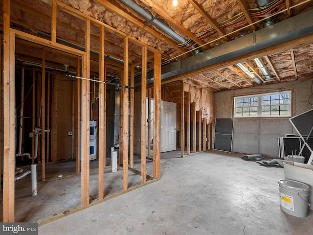 misc room with unfinished concrete flooring